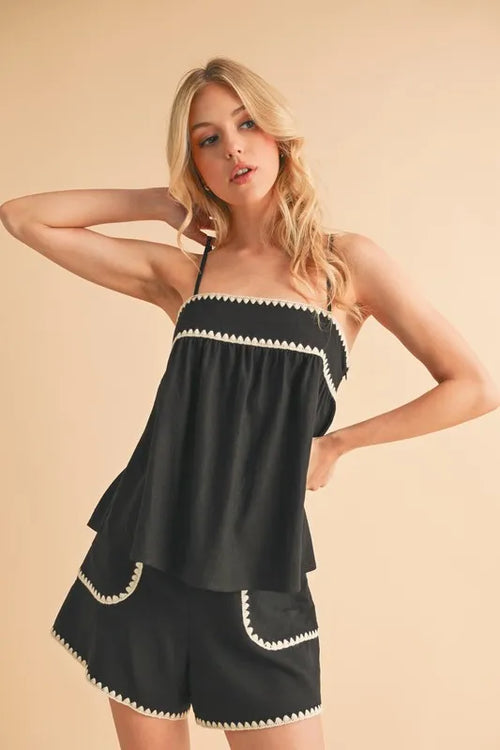 Black cami and shorts set with contrast rickrack trim and layered peplum hem