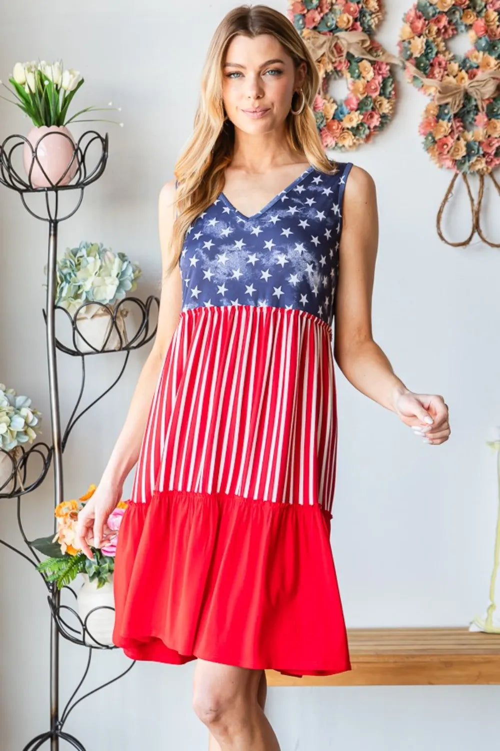 Sleeveless tank dress with blue star top and red striped skirt, tiered hem