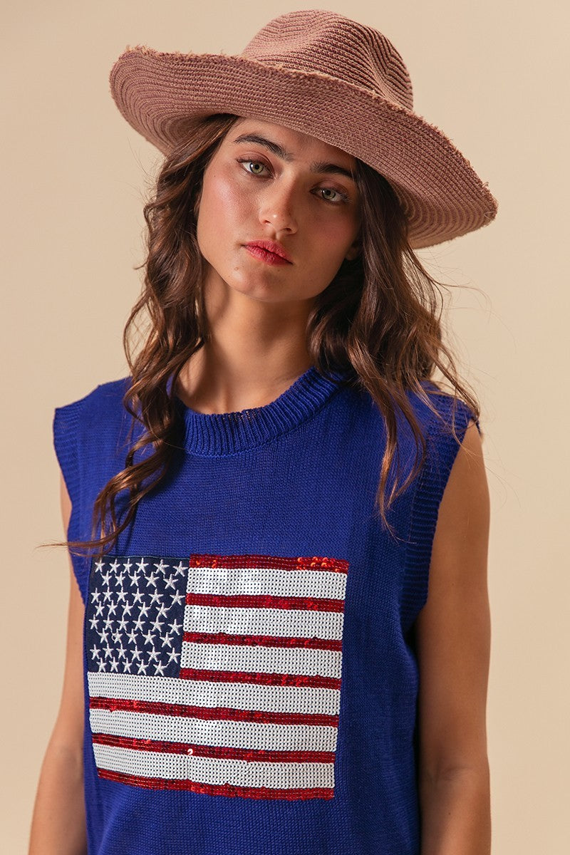 Royal blue sleeveless knit top with sequin American flag patch at chest