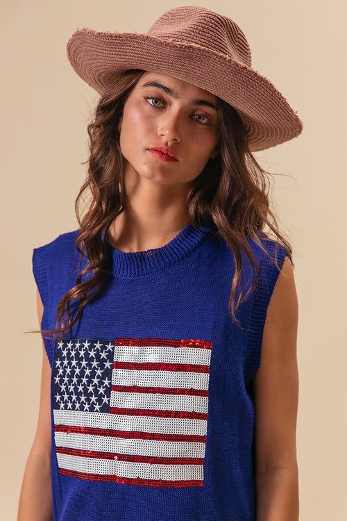 Royal blue sleeveless knit top with sequin American flag patch at chest