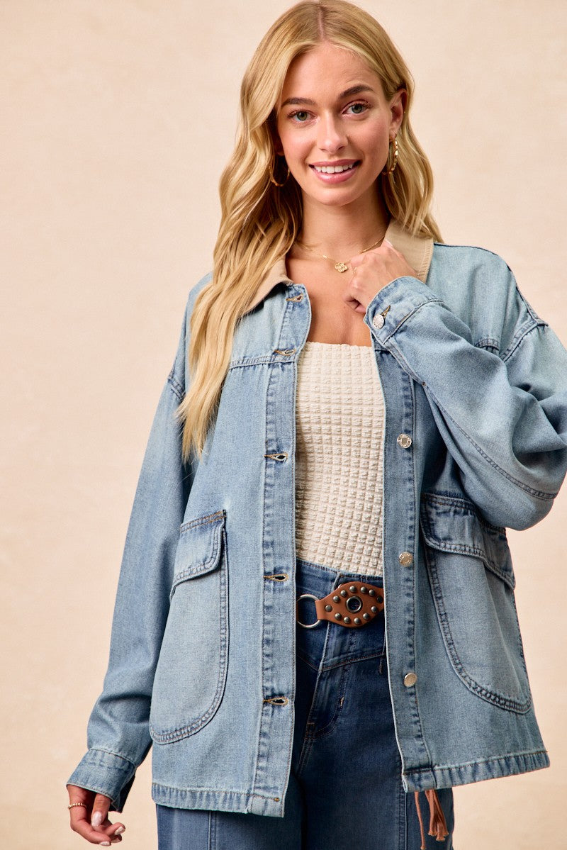 Washed denim jacket with contrast collar; button placket and flap pockets visible.
