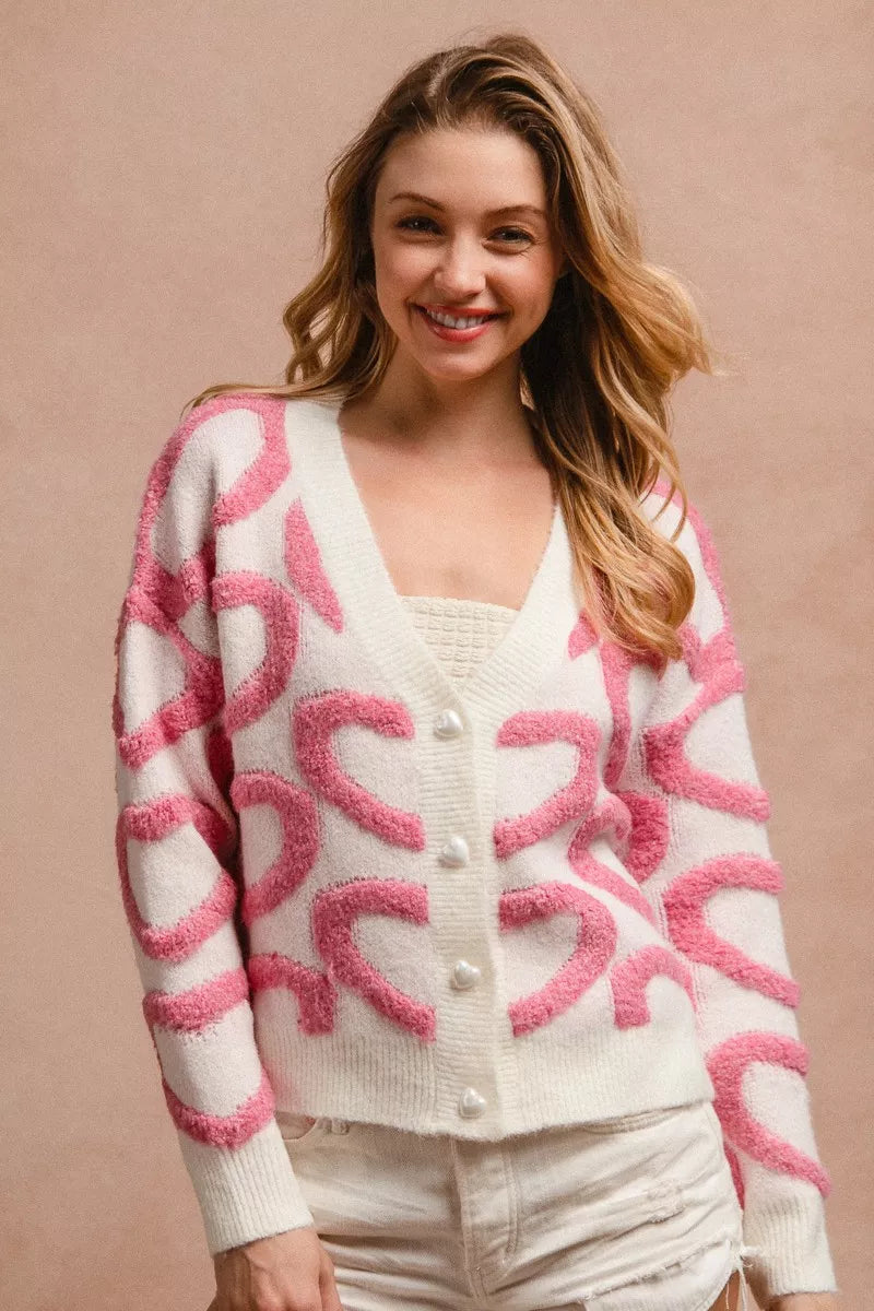 Textured heart button-up V-neck cardigan in pink and white, long sleeves, front buttons