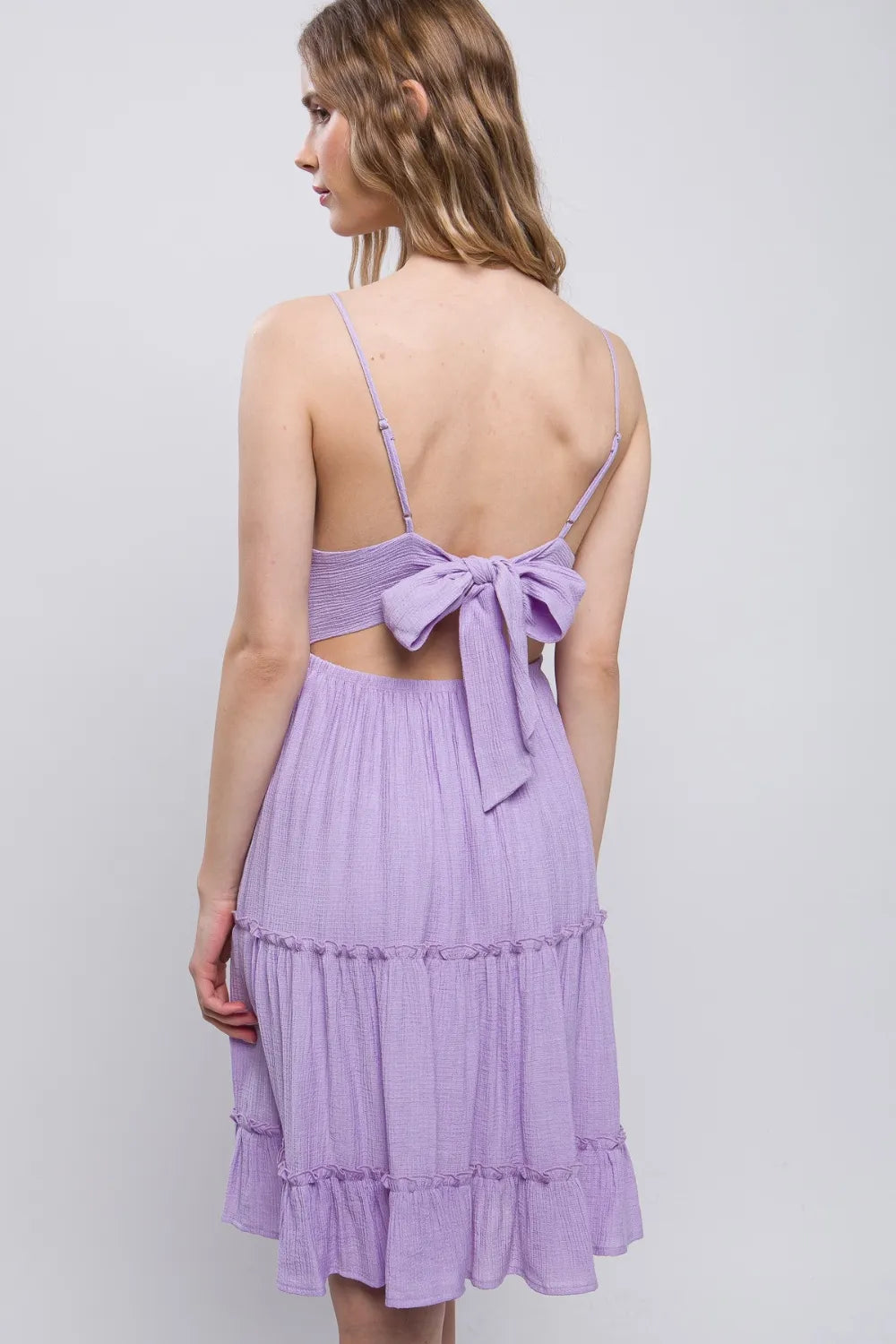 Back view: lavender lace cami dress with open back and bow tie