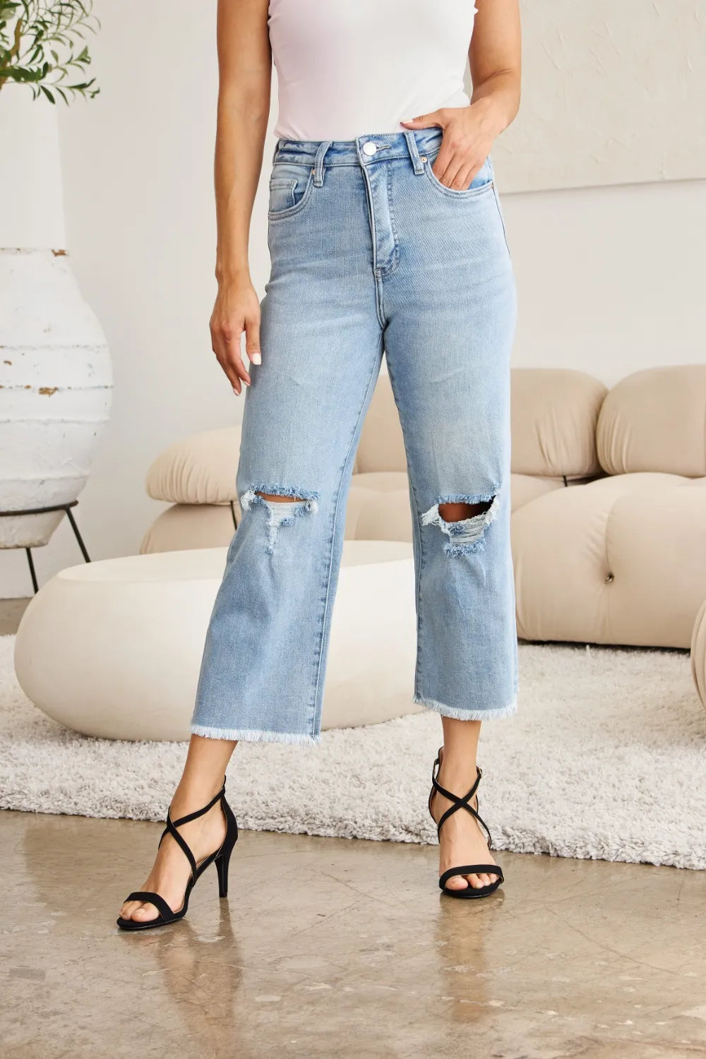 Light wash high-waist tummy control jeans, raw hem, distressed knee rips