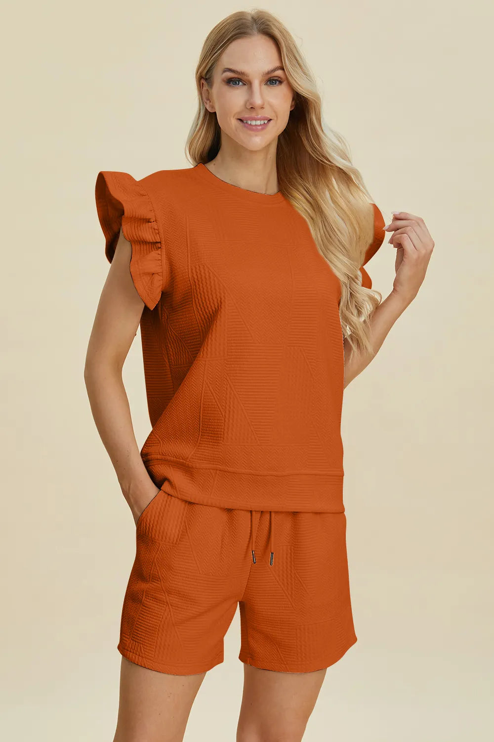 Tangerine textured ruffle sleeve top with matching drawstring shorts set