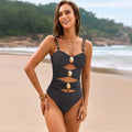 Black cutout ruched one-piece swimsuit, front view with sweetheart neckline and high waist