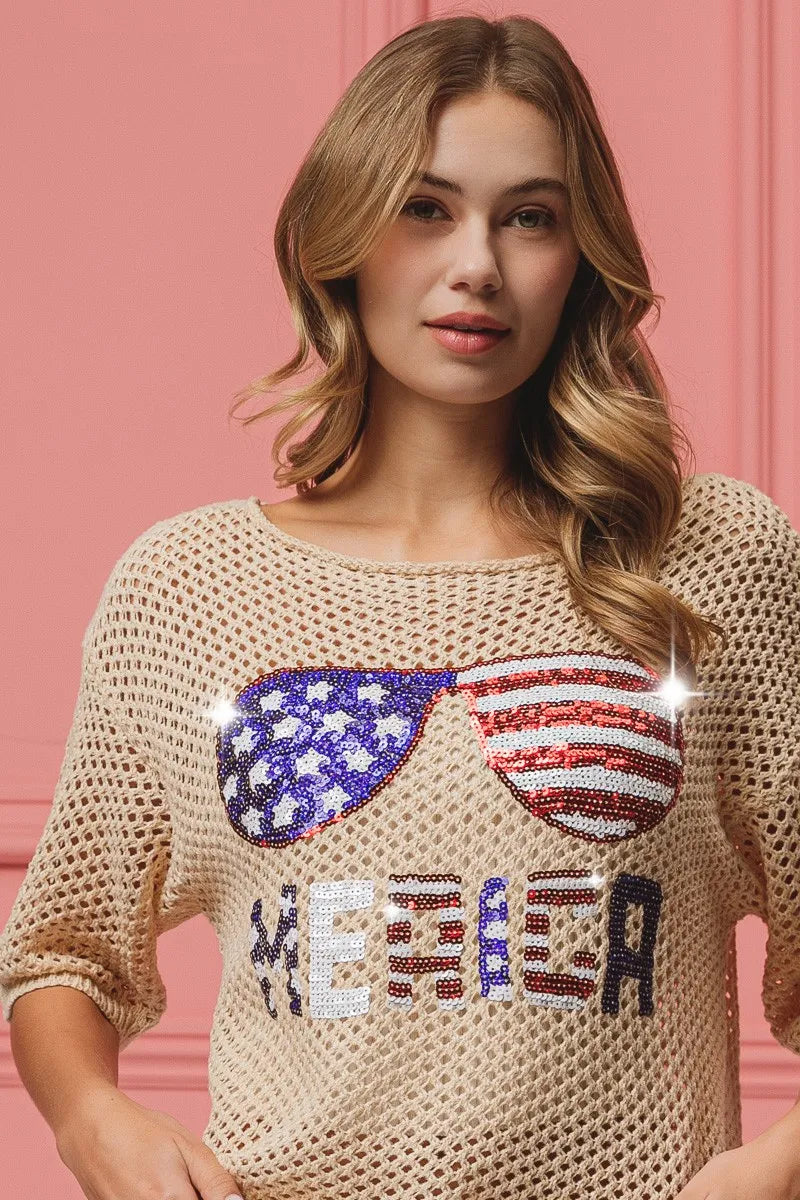 OATMEAL knit cover-up with glittering sequin flag sunglasses and 'ME&ED' text