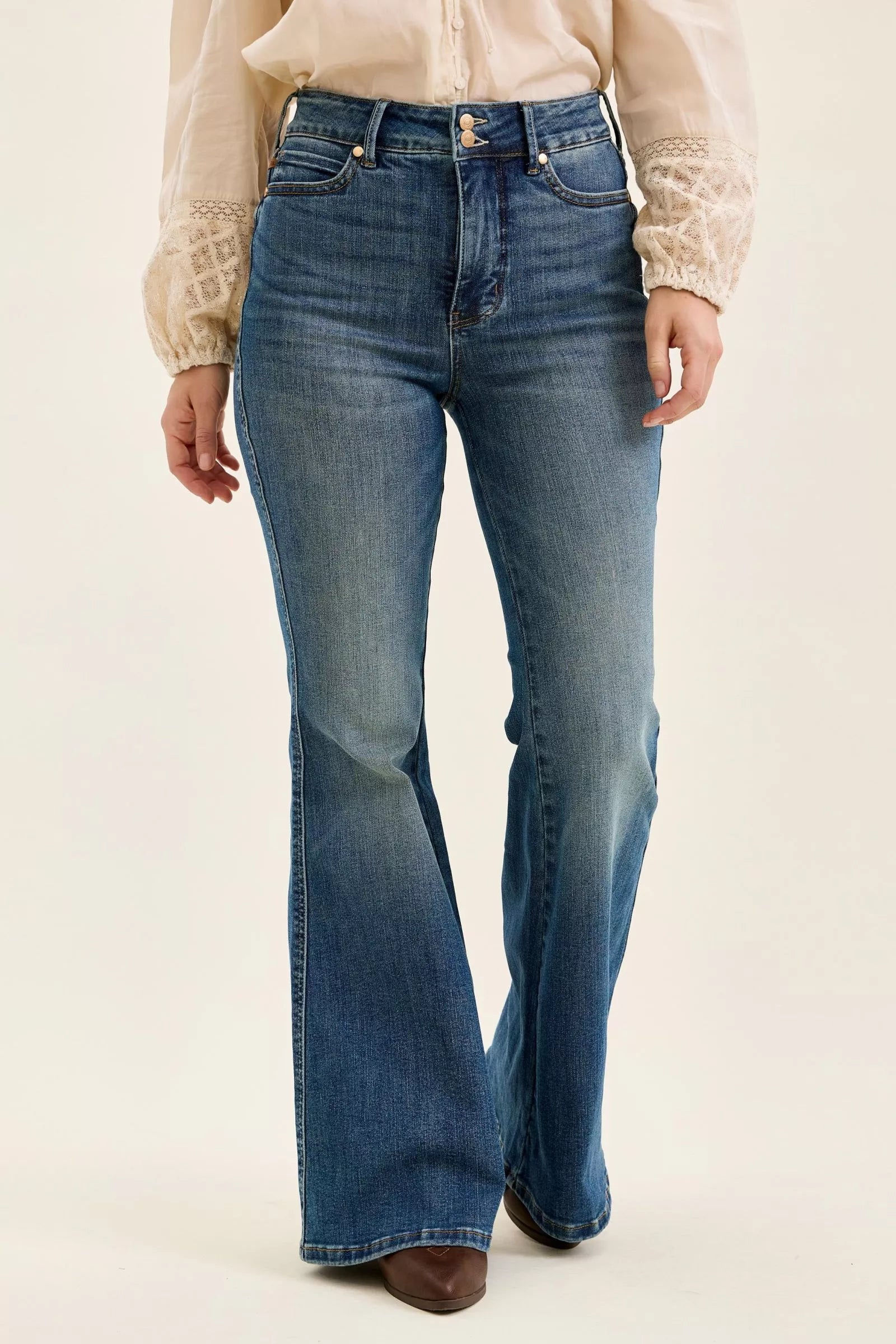 Dark denim high-waist flare jeans with double-button closure and five-pocket design