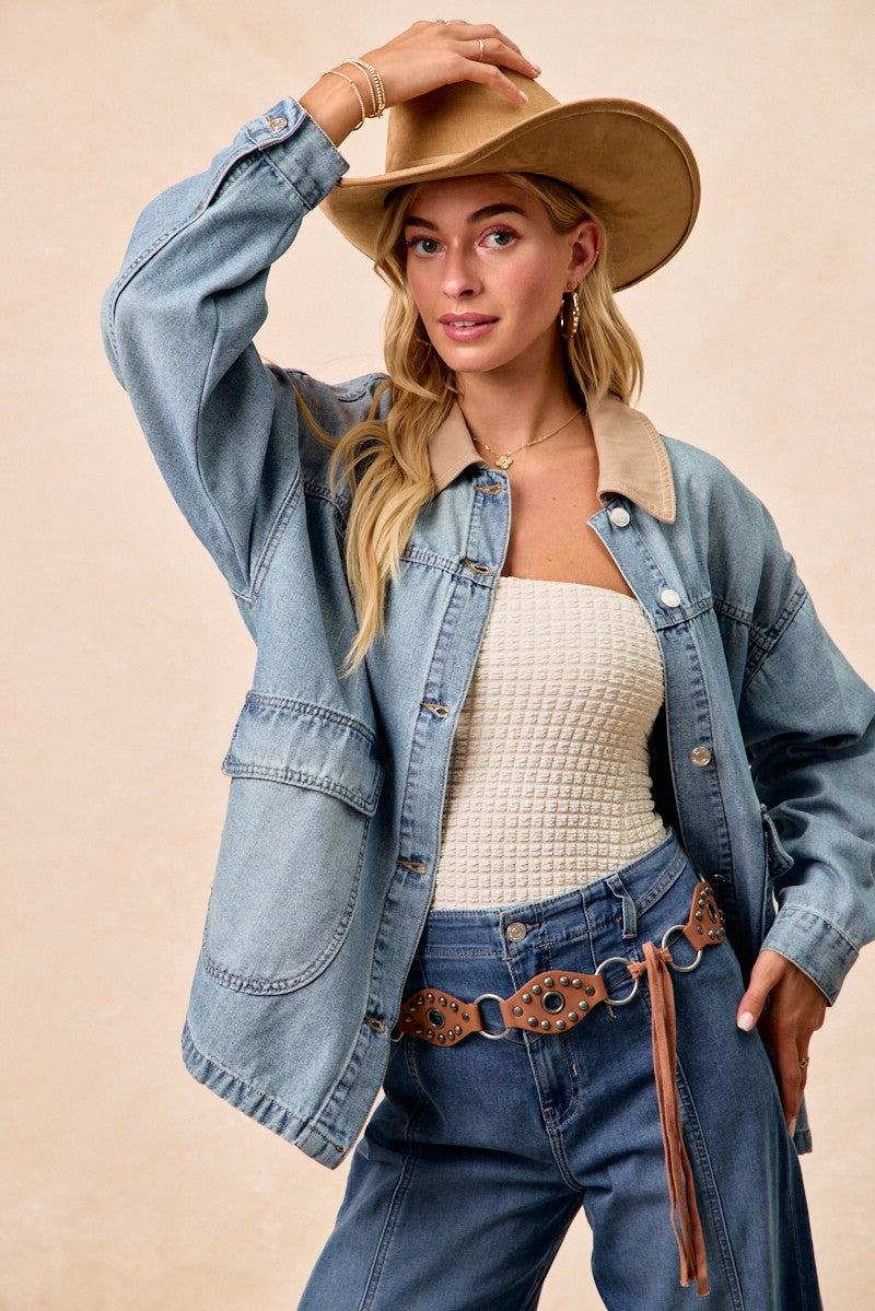 Relaxed light-wash denim jacket with contrast collar, chest pockets, and button front.