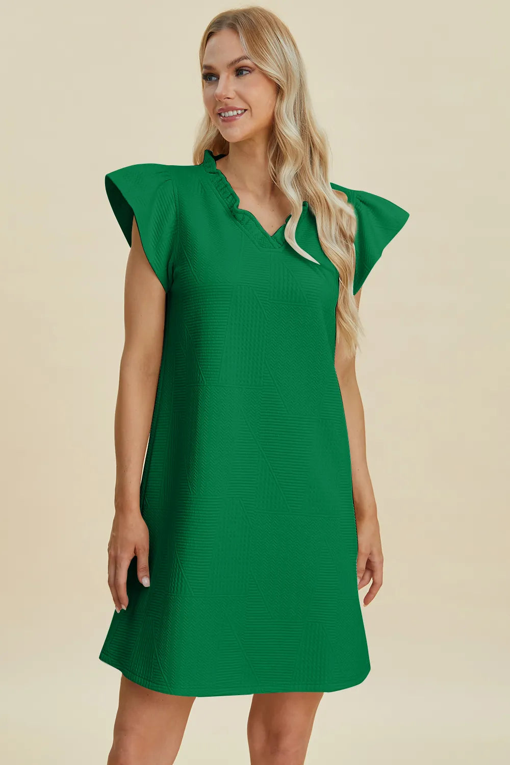 Ruffled V-neck cap sleeve dress in dark green, front view with ruffled shoulder sleeves.