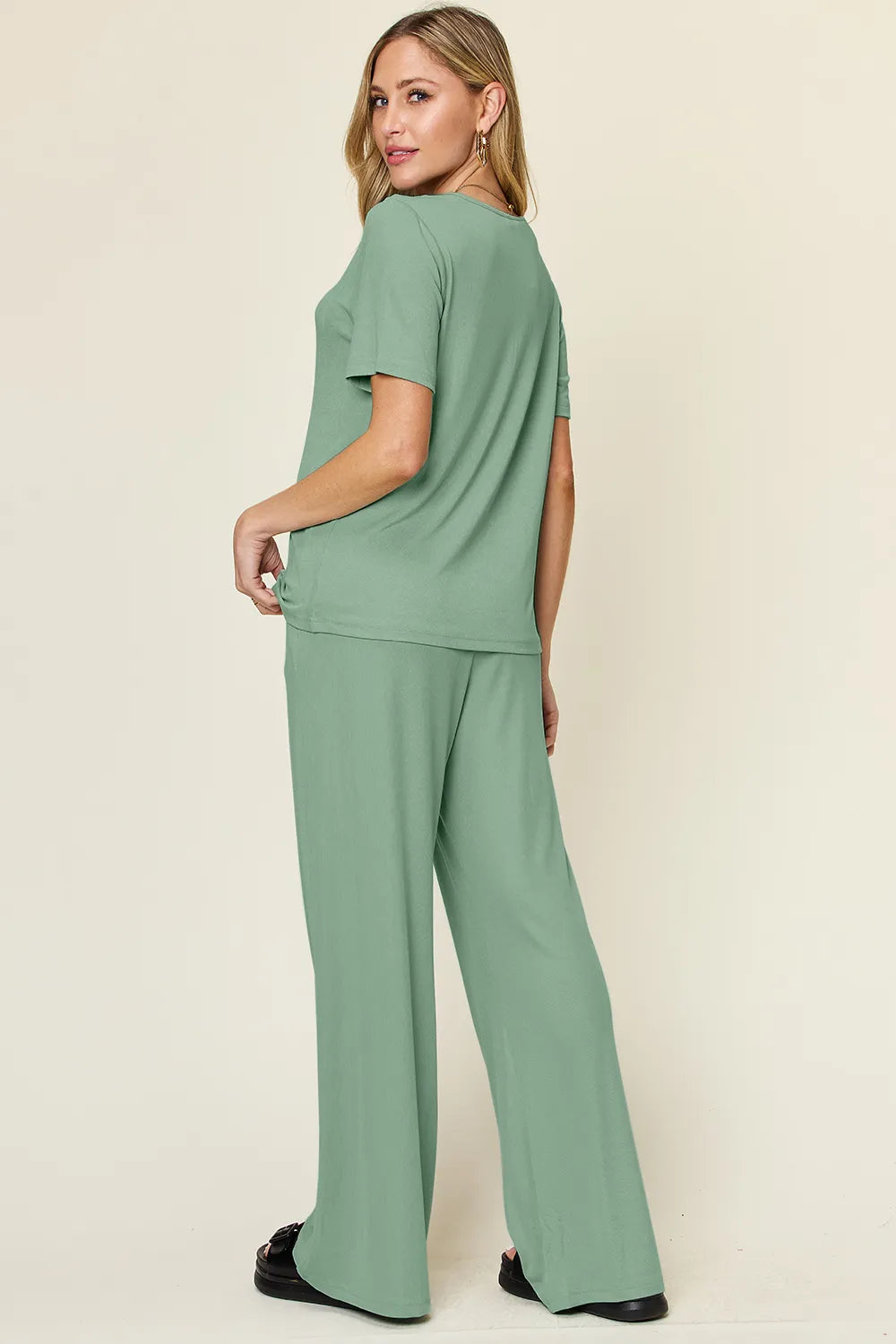 Light green round-neck T-shirt and wide-leg pants set, back view