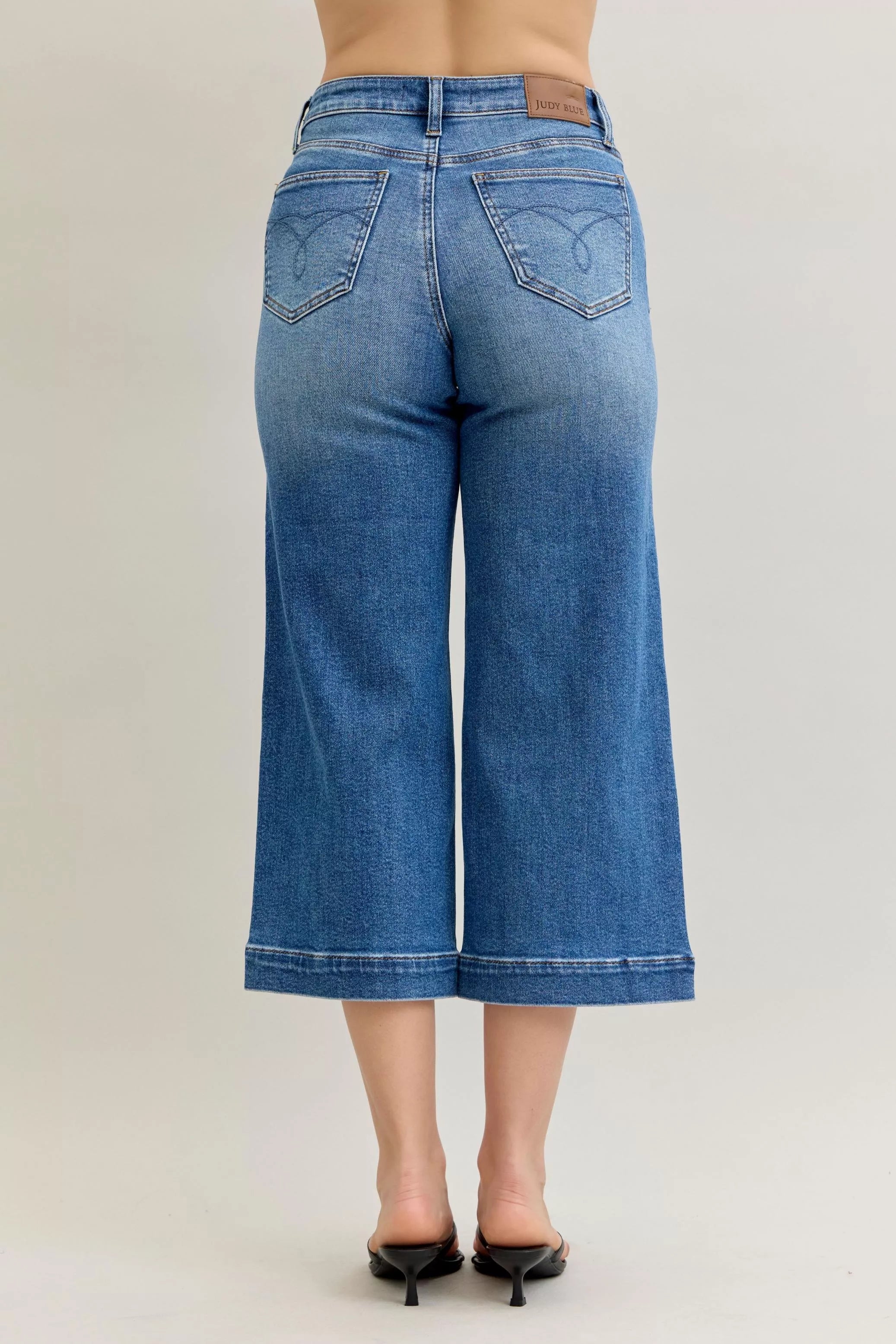 Judy Blue mid rise crop wide-leg jeans, light blue back pockets and seam details