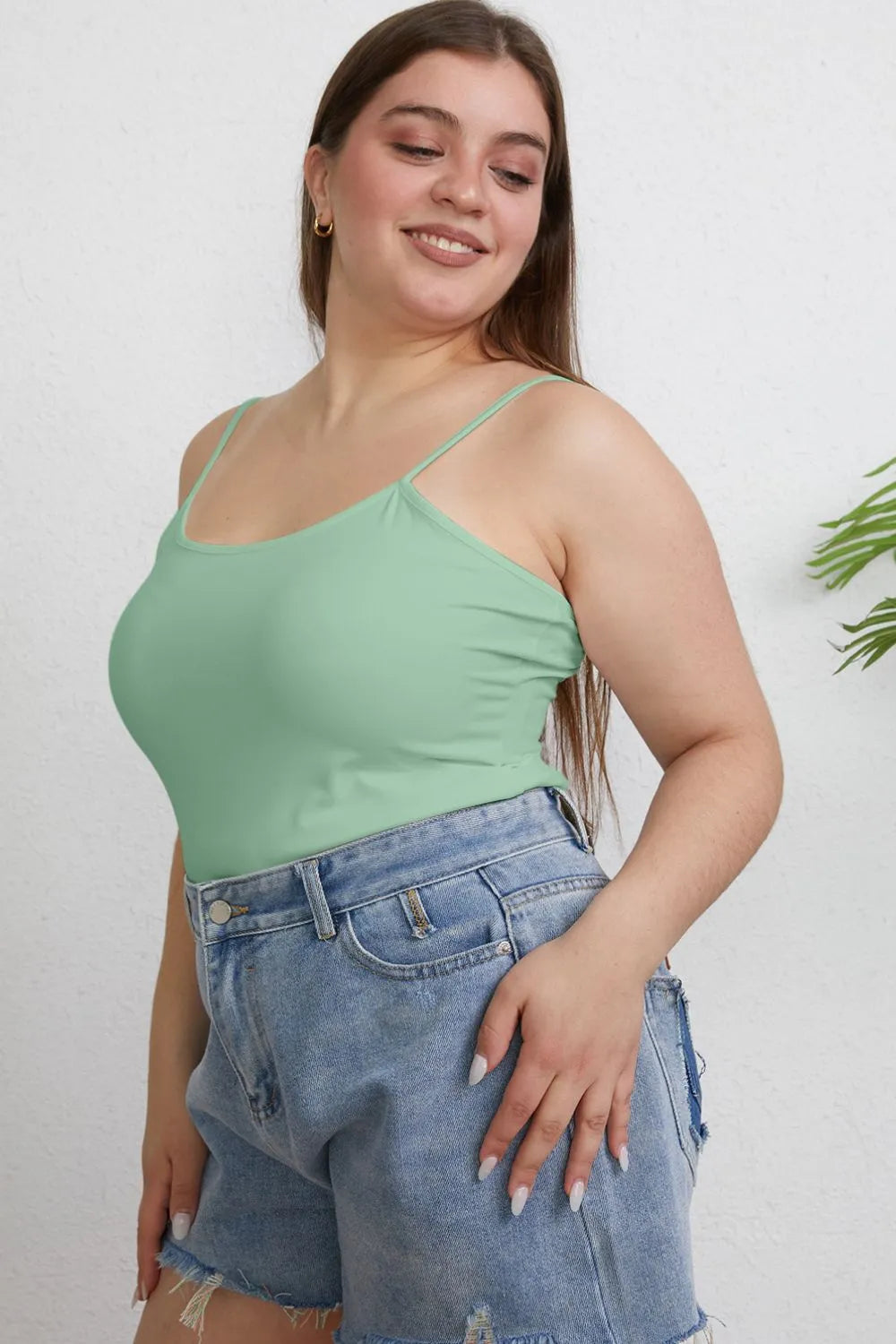 Light green plus-size cami with thin spaghetti straps and fitted round neck