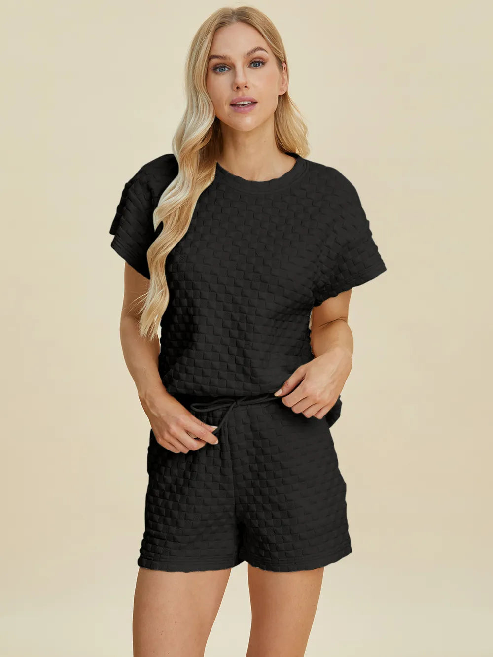 Black textured T-shirt and shorts set, crew neck, short sleeves and matching shorts.