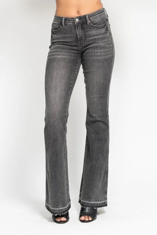 Washed gray mid-rise flare jeans with frayed hem, five-pocket styling and dark topstitching