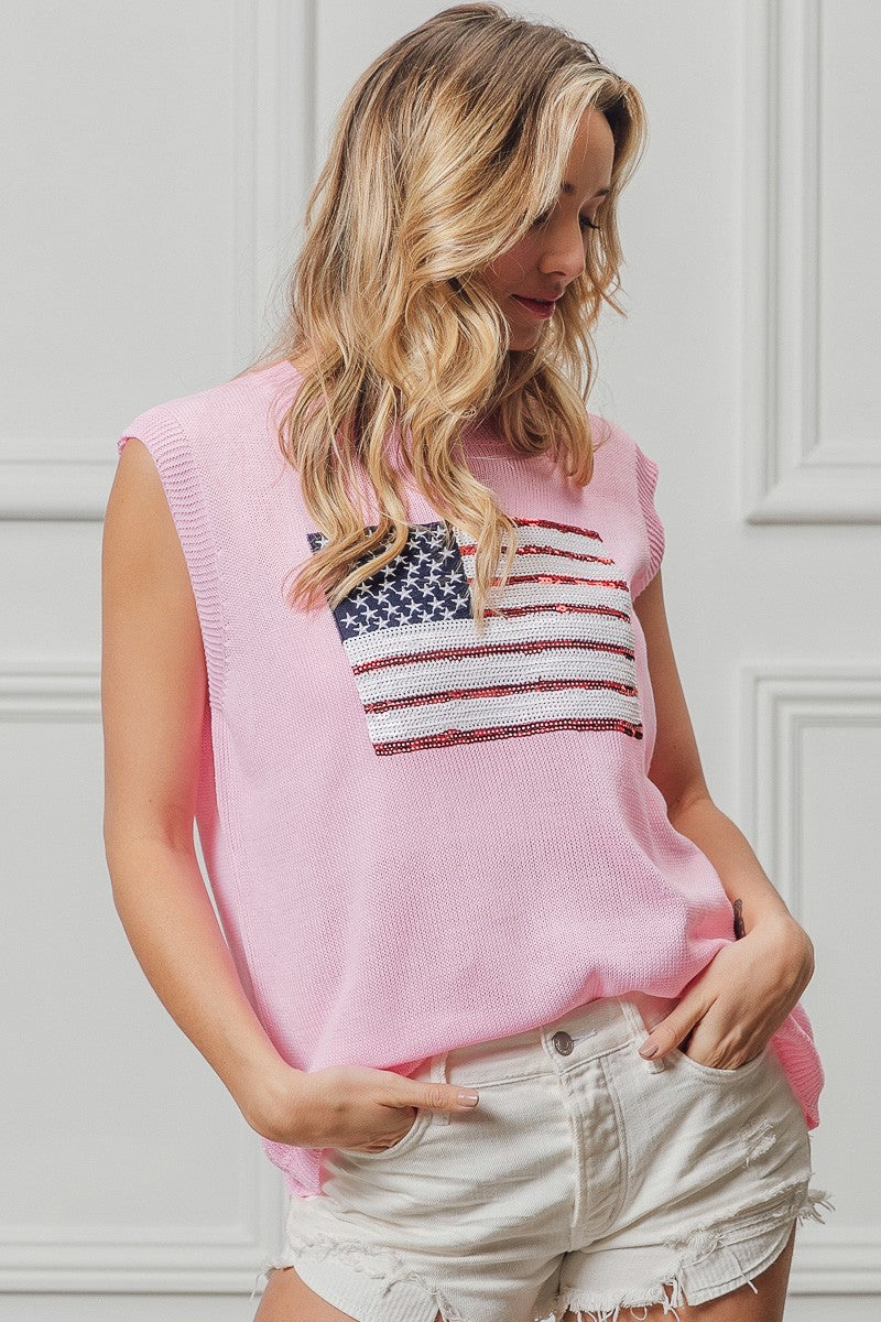 Pink knit sleeveless top with star-and-stripe sequin flag patch