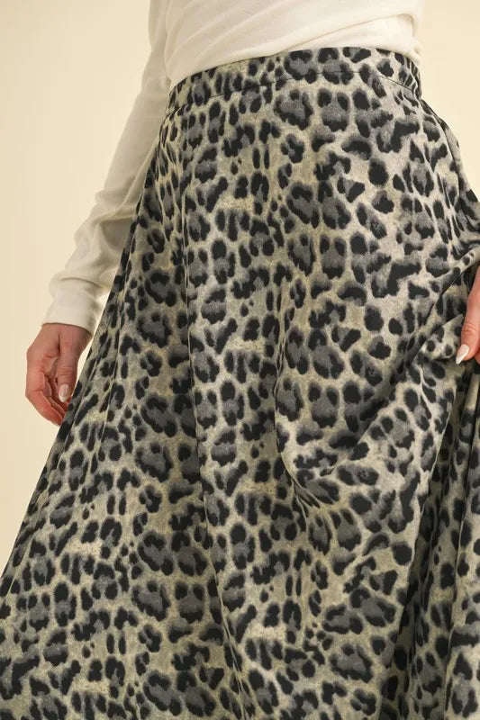 Leopard midi skirt close-up: dark spot print, gathered waistband