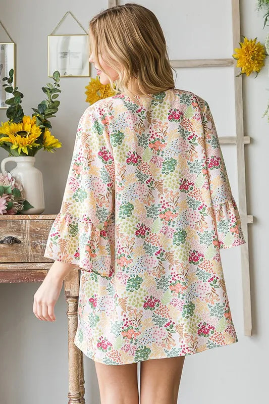 Ivory multi floral open cardigan, plus size; back view with relaxed fit