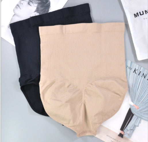 Nude and black high-waisted shaping panties set, folded for display