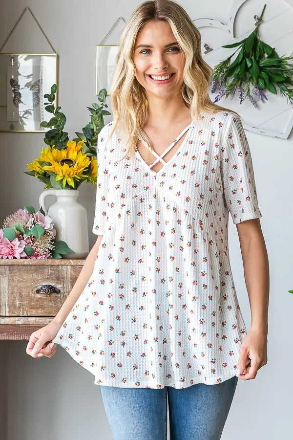 Heimish Plus babydoll top in white with ditsy floral print, crisscross neckline