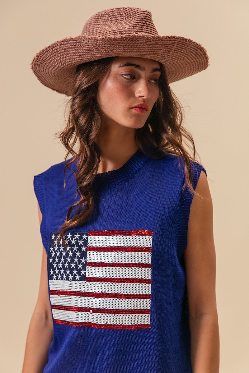 Royal blue knit sleeveless vest with sequin American flag patch, side view