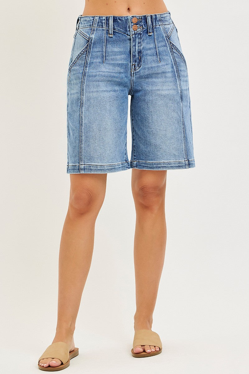 Medium-wash denim jorts side view, two-button front and relaxed fit