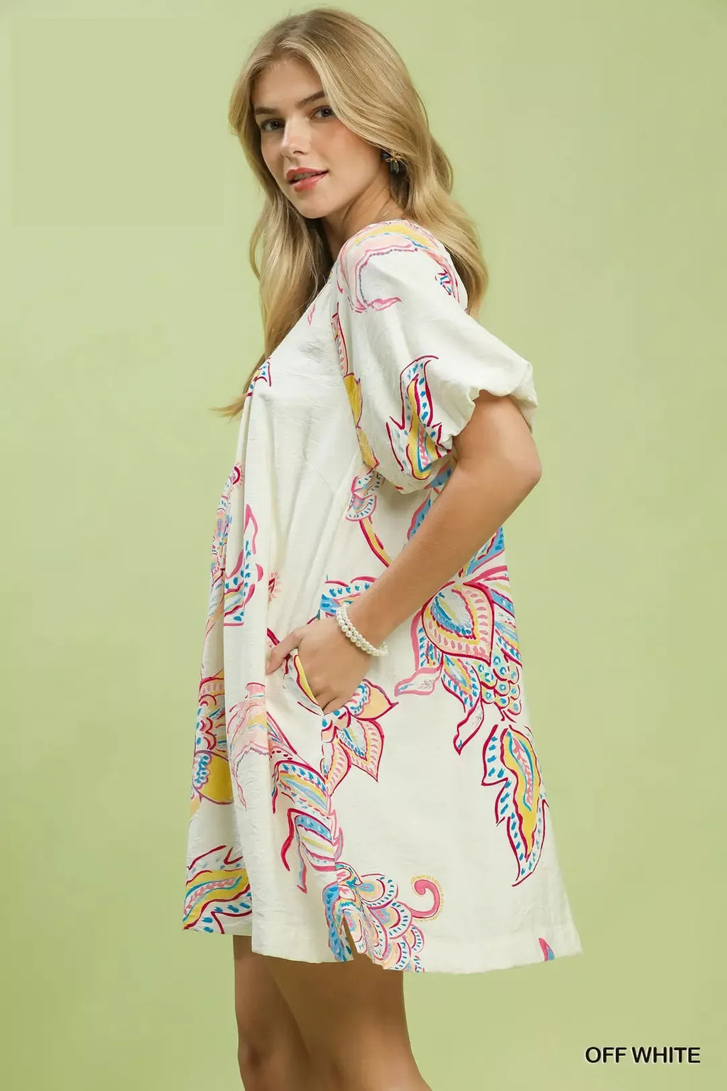 Off-white boho floral mini dress, side profile with flowy loose fit