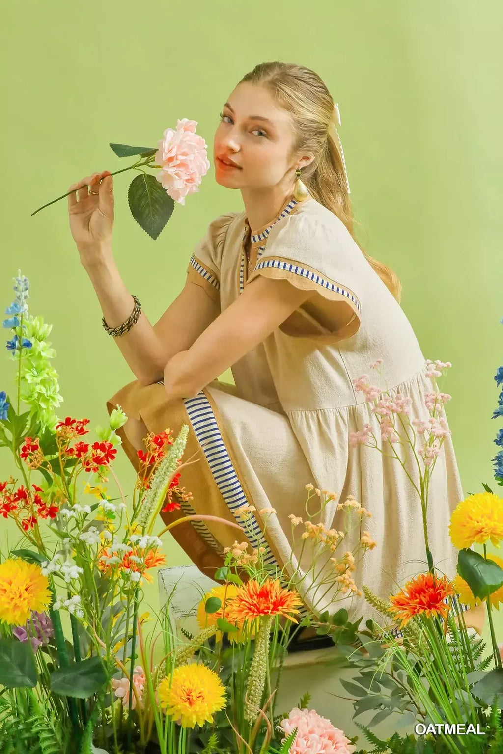 Oatmeal linen dress with blue striped trim at collar and sleeves; tiered skirt