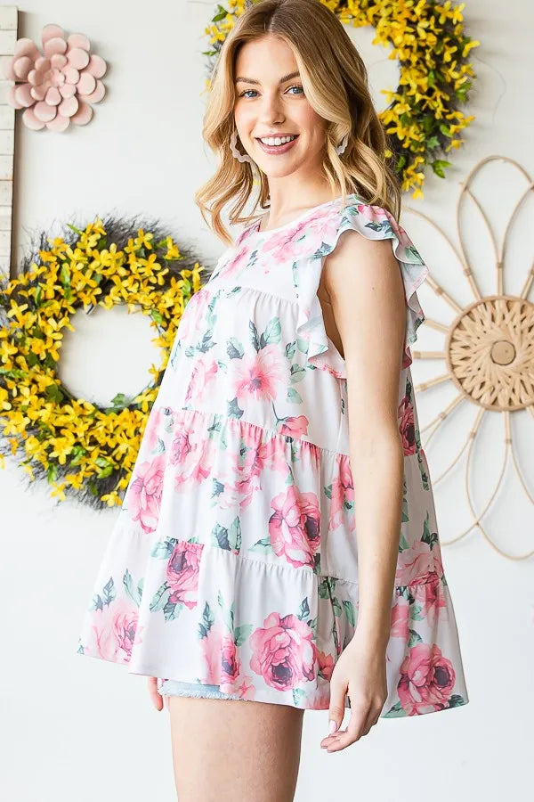 Cream floral tiered mini top with ruffle cap sleeves and round neck, side view