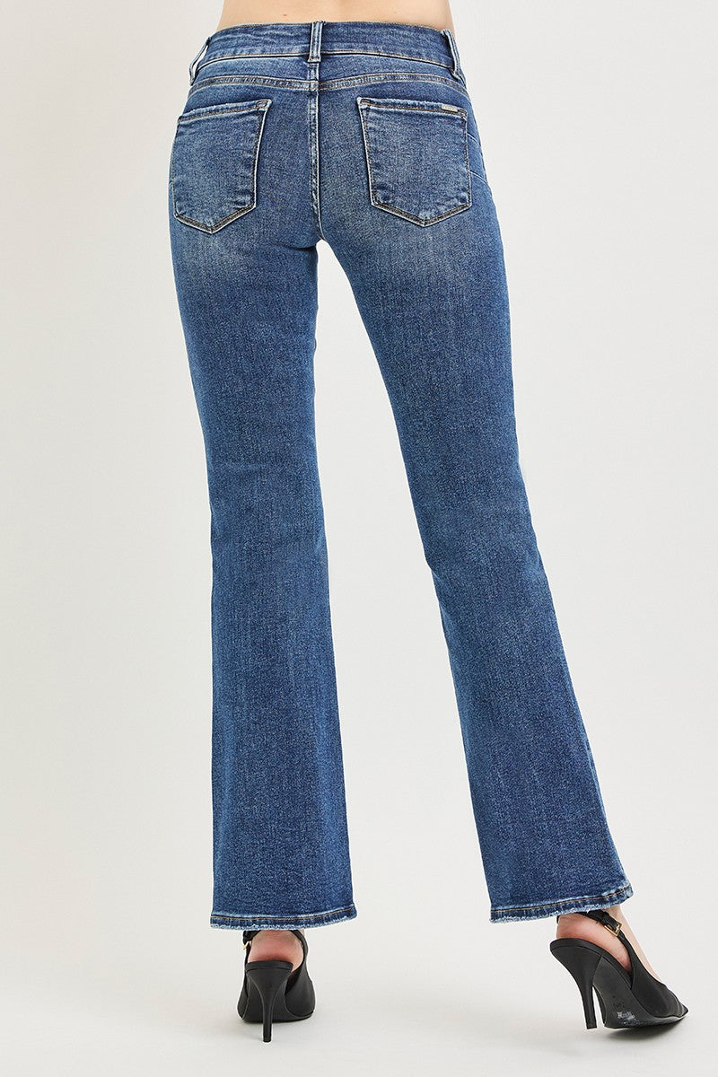 Medium wash bootcut jeans side profile with visible seams and wide flared leg opening