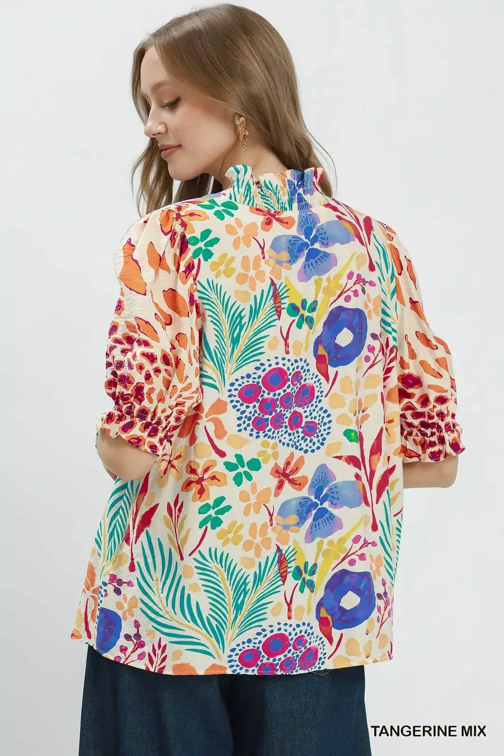 Back view of multicolor V-neck ruffle puff sleeve top with floral and animal pattern