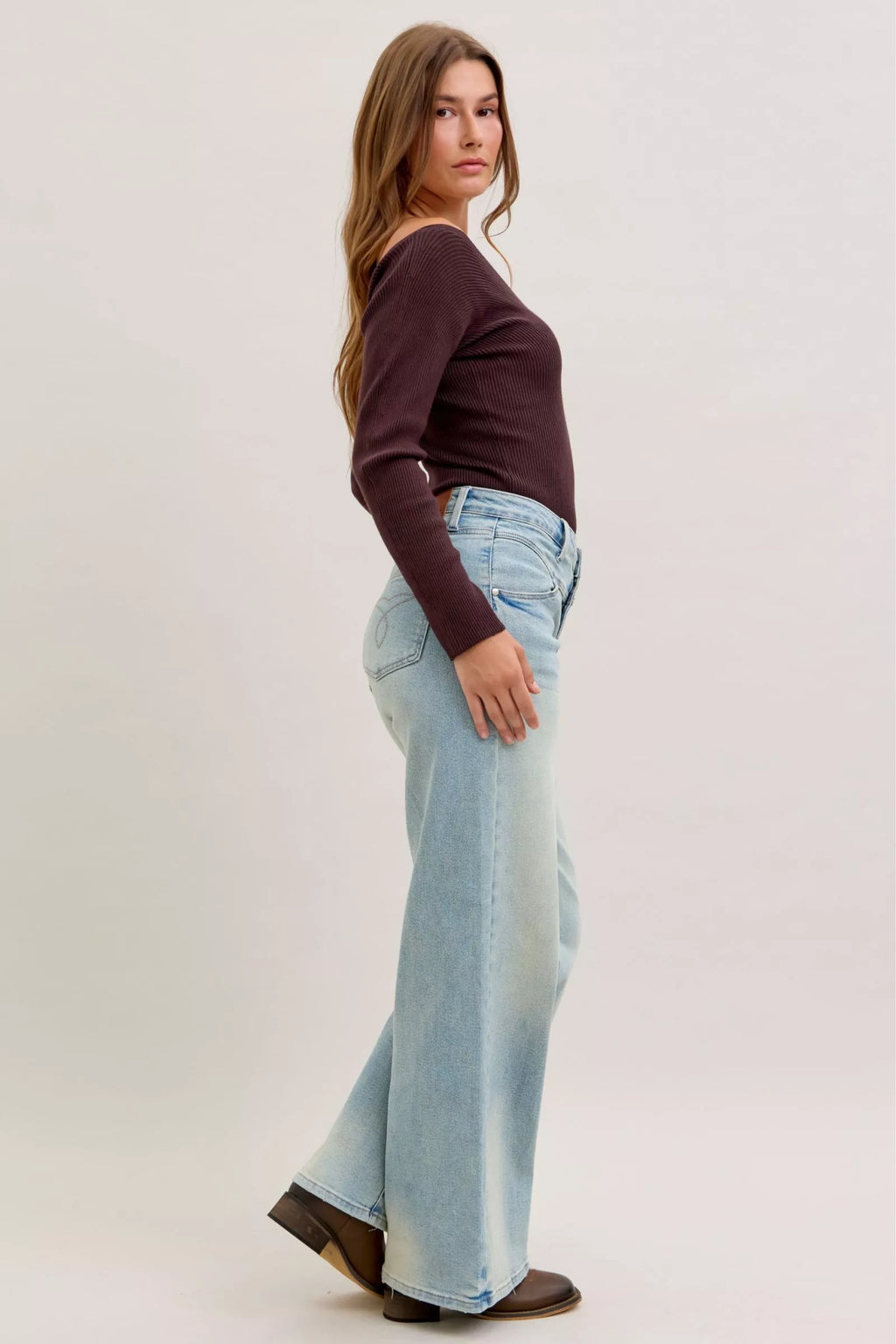 Light blue high-waist straight jeans, side view with relaxed straight leg and belt loops