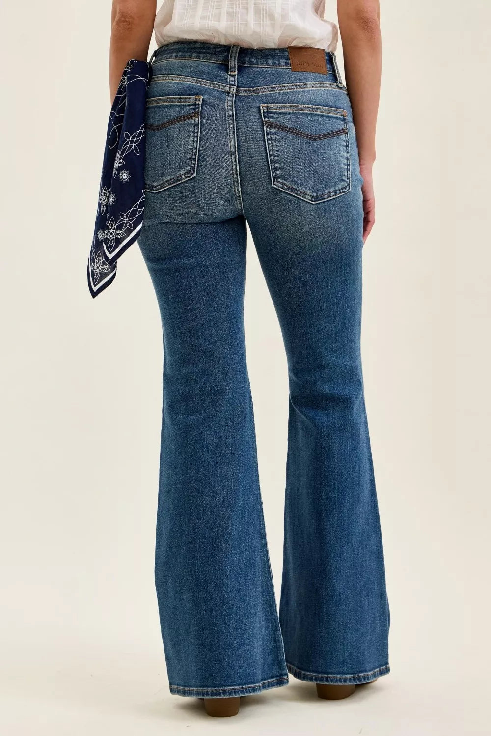 Mid-rise flare jeans with back pocket stitching and bandana loop on waistband