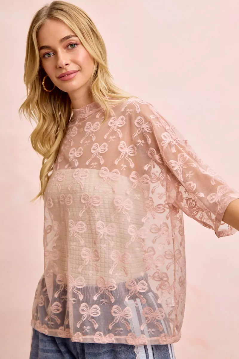Dusty rose bow-pattern mesh top with round neck, relaxed boxy fit, short sleeves