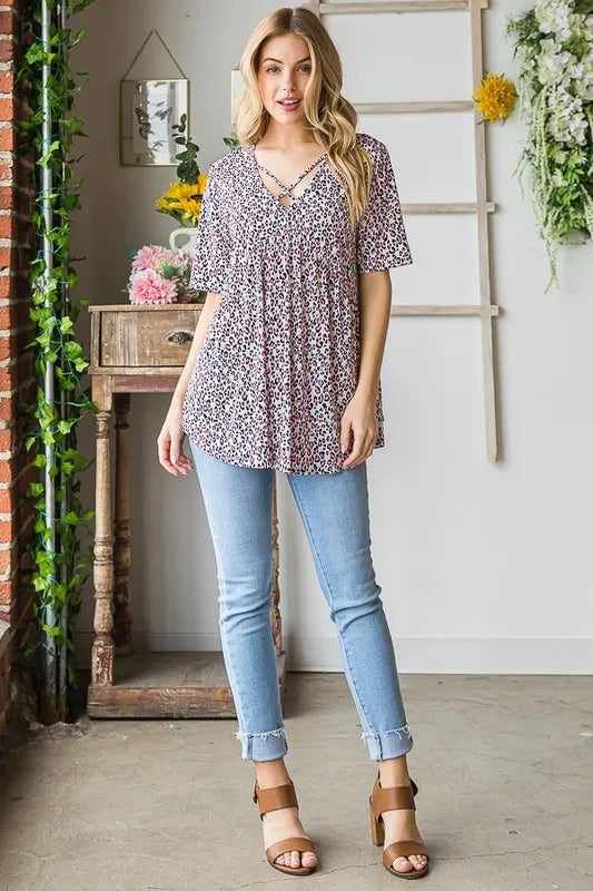 Ivory animal-print babydoll top with crisscross V neckline, short sleeves (plus size)
