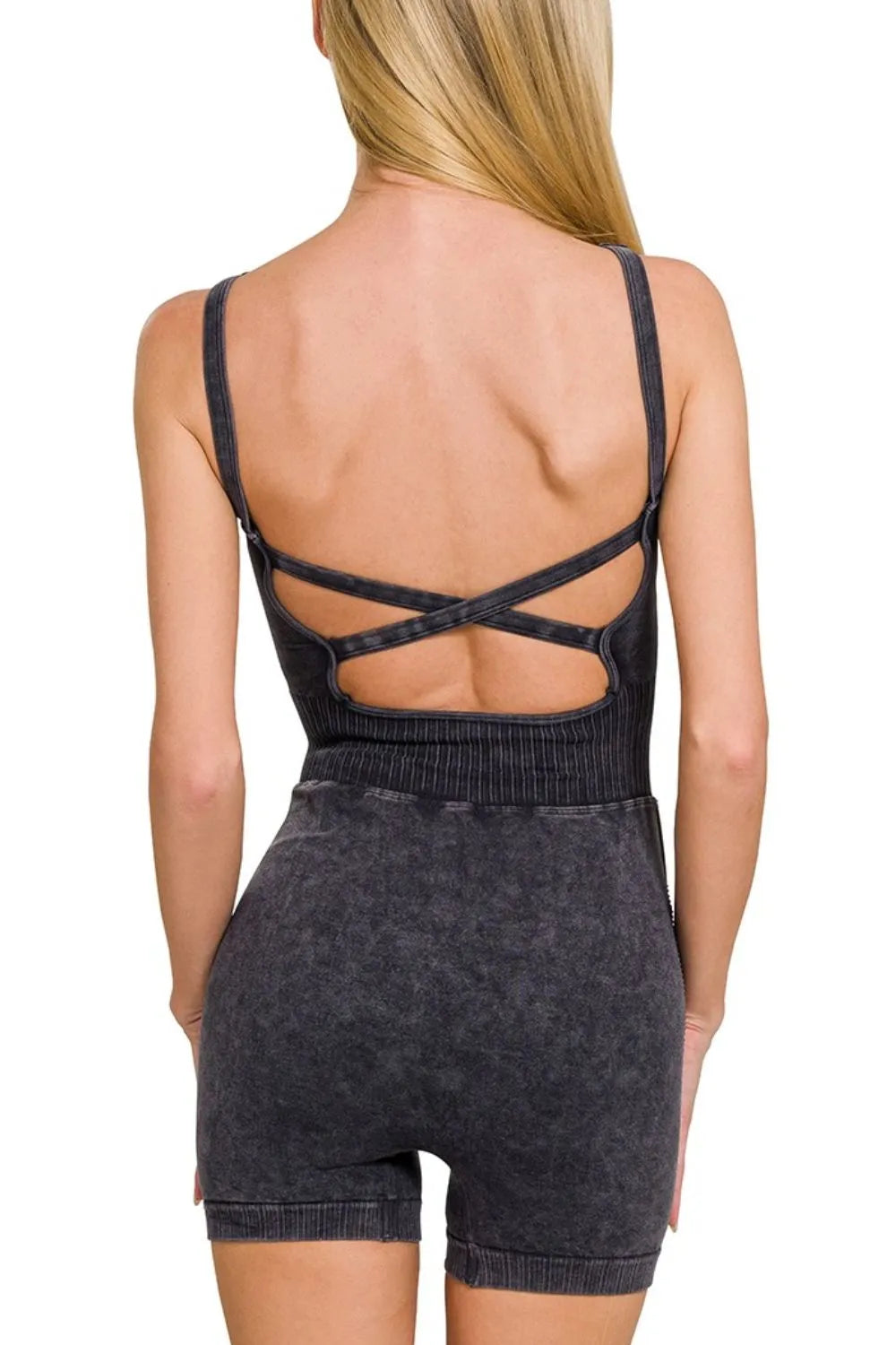 Back view: washed black sports romper with crisscross open-back straps