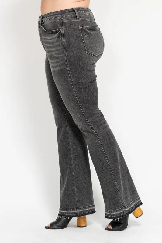 Washed gray mid-rise flared jeans, rear view with yoke stitching and belt loops