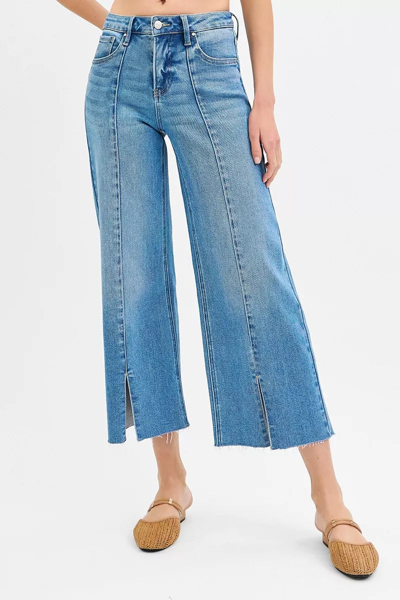 Medium-wash wide-leg jeans with front slit seams, mid-rise fit
