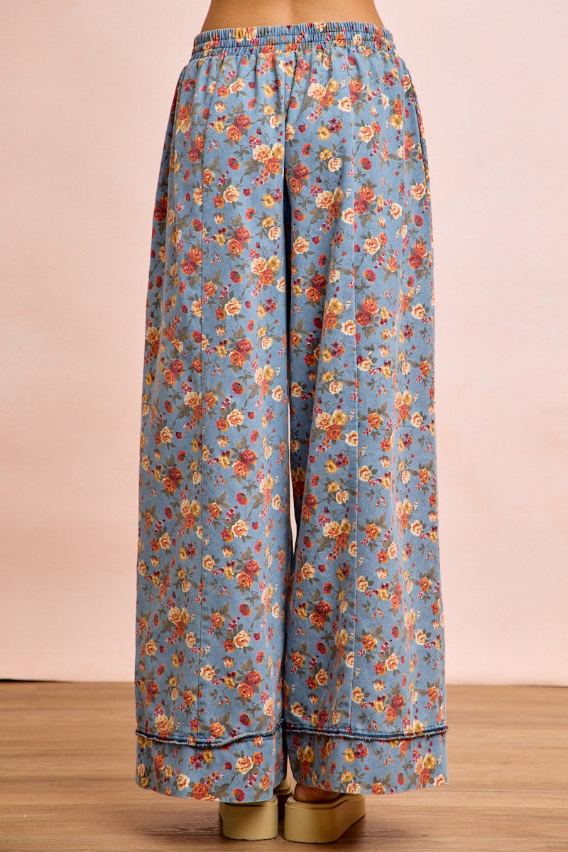 Denim-blue floral wide-leg pants, straight drape; elastic waist and drawstring
