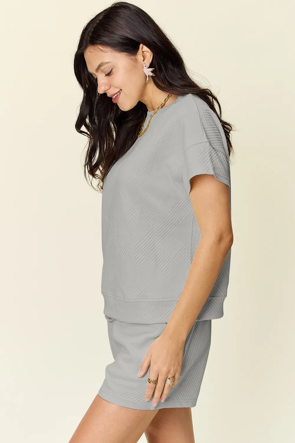 Light gray textured T-shirt with matching drawstring shorts, side view