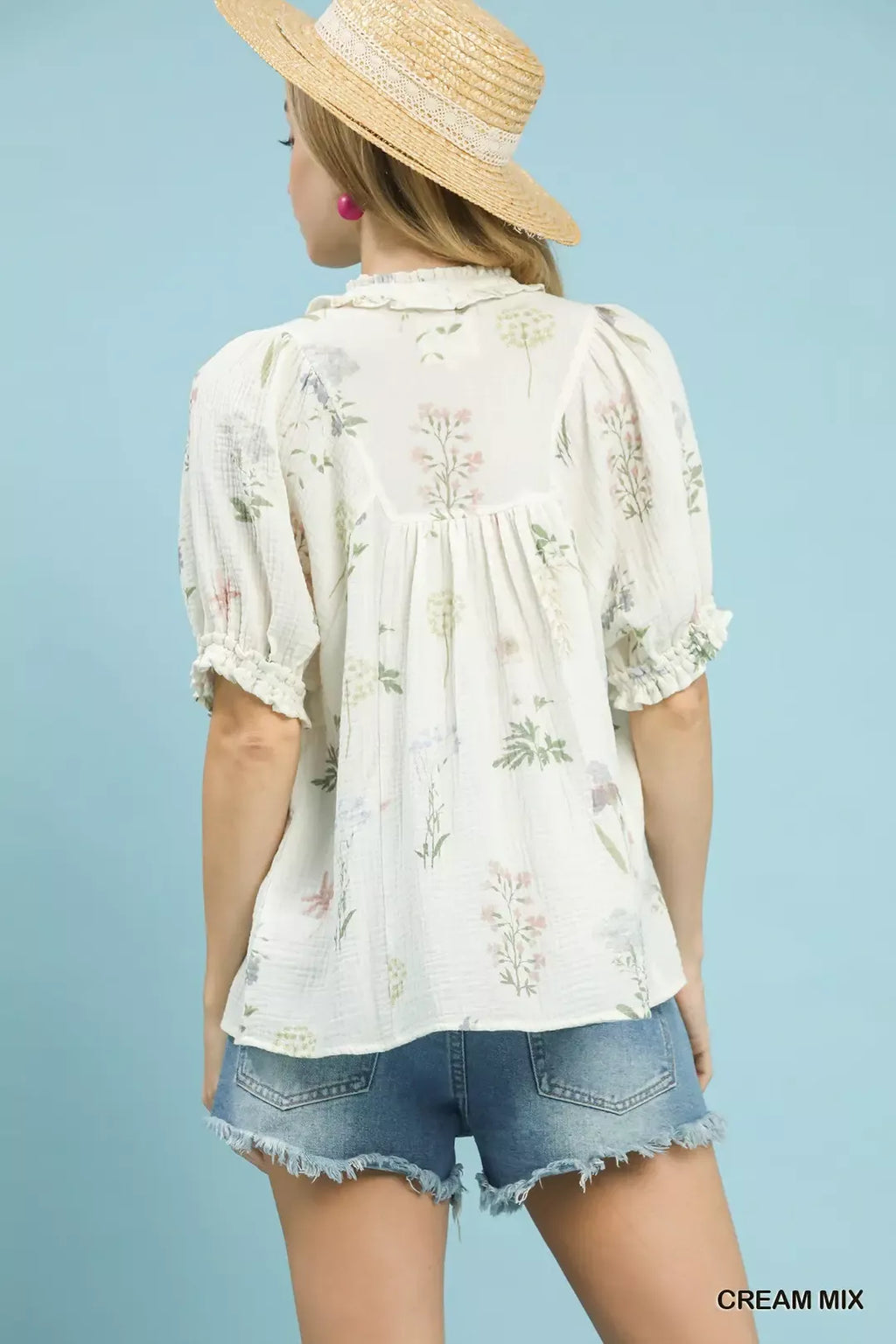 Back view: cream mix floral cotton gauze top with gathered yoke and puff sleeves