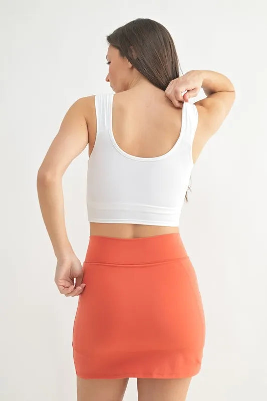 White active tank back view with scoop back and ruched center seam