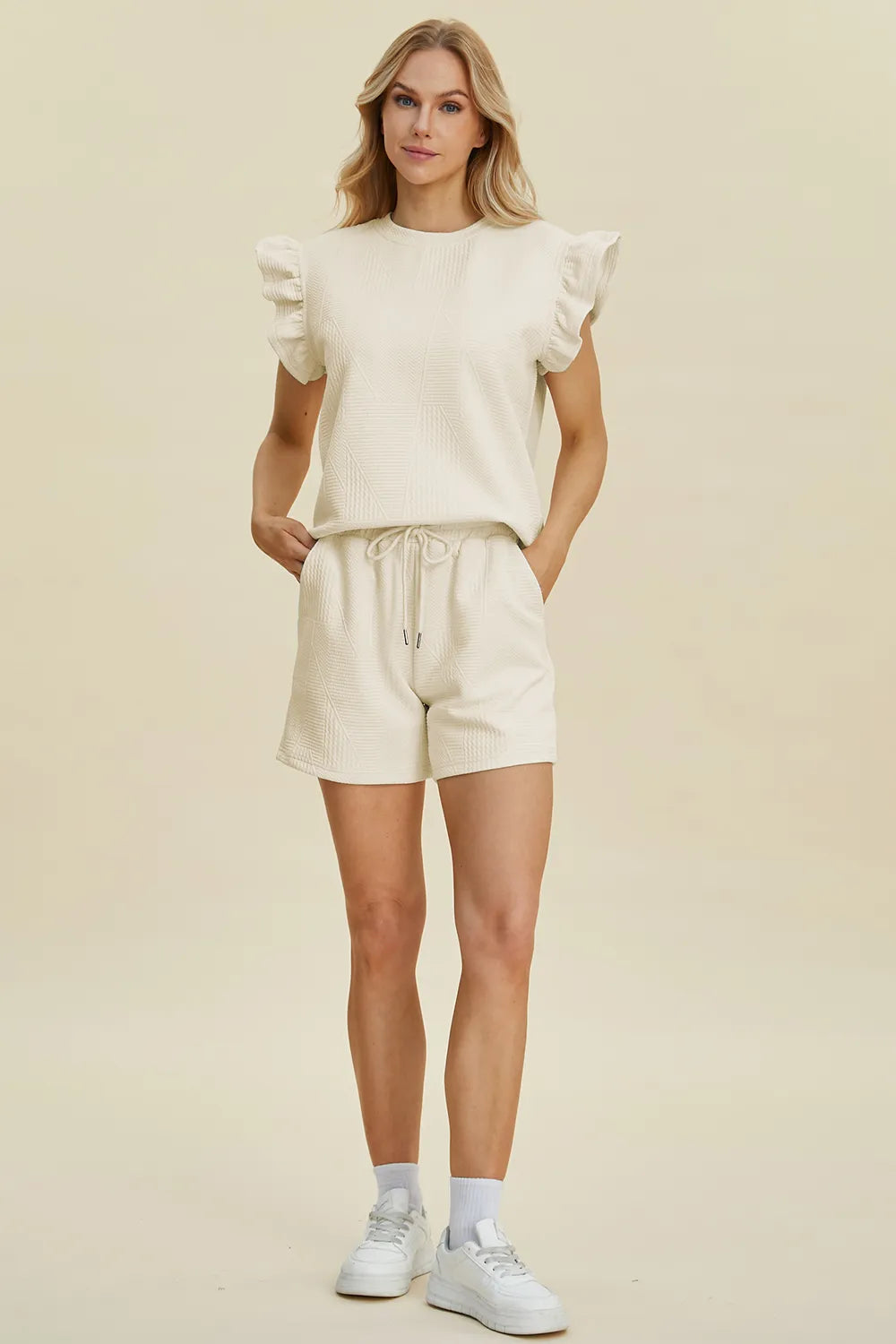 Cream textured co-ord set with ruffle sleeves top and drawstring shorts