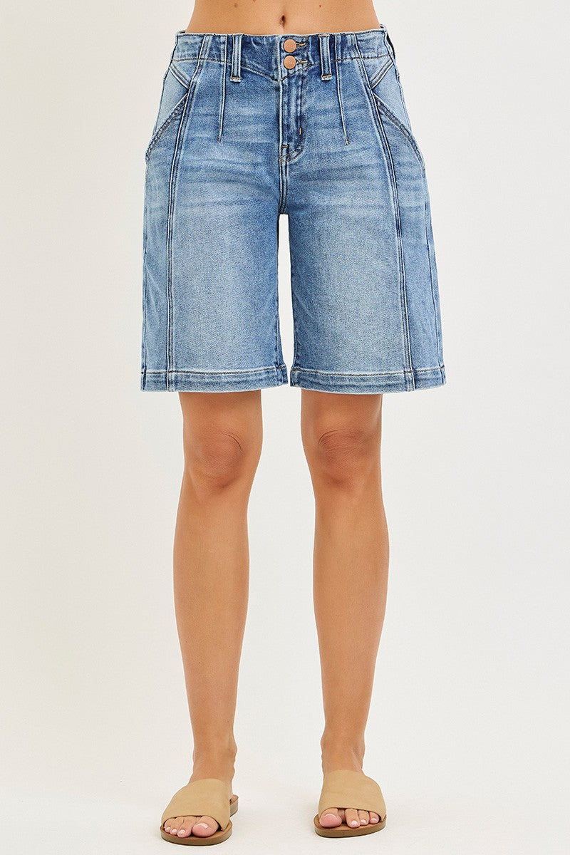 Medium-wash slouchy jorts front view with two-button waistband