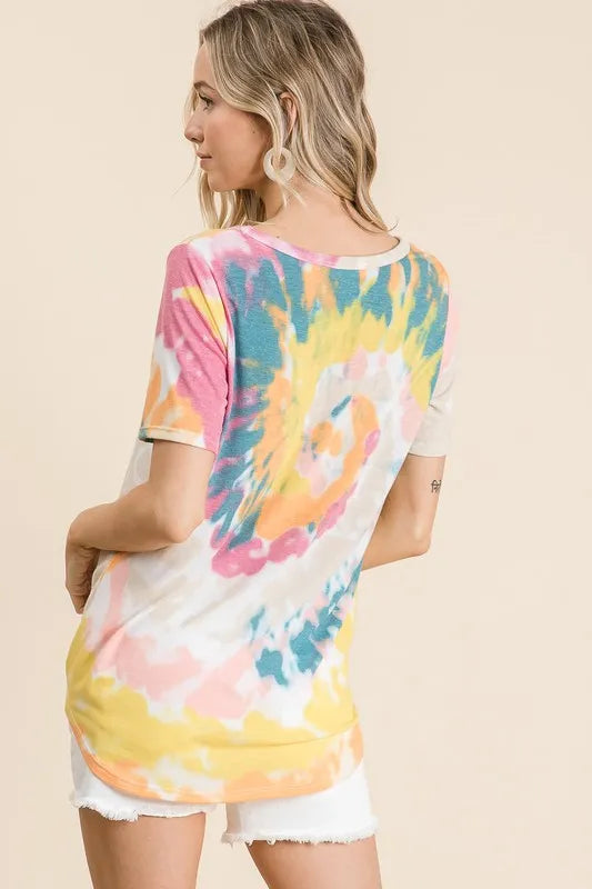 Back view of V-neck tie-dye top in yellow-orange, pink, and teal with short sleeves