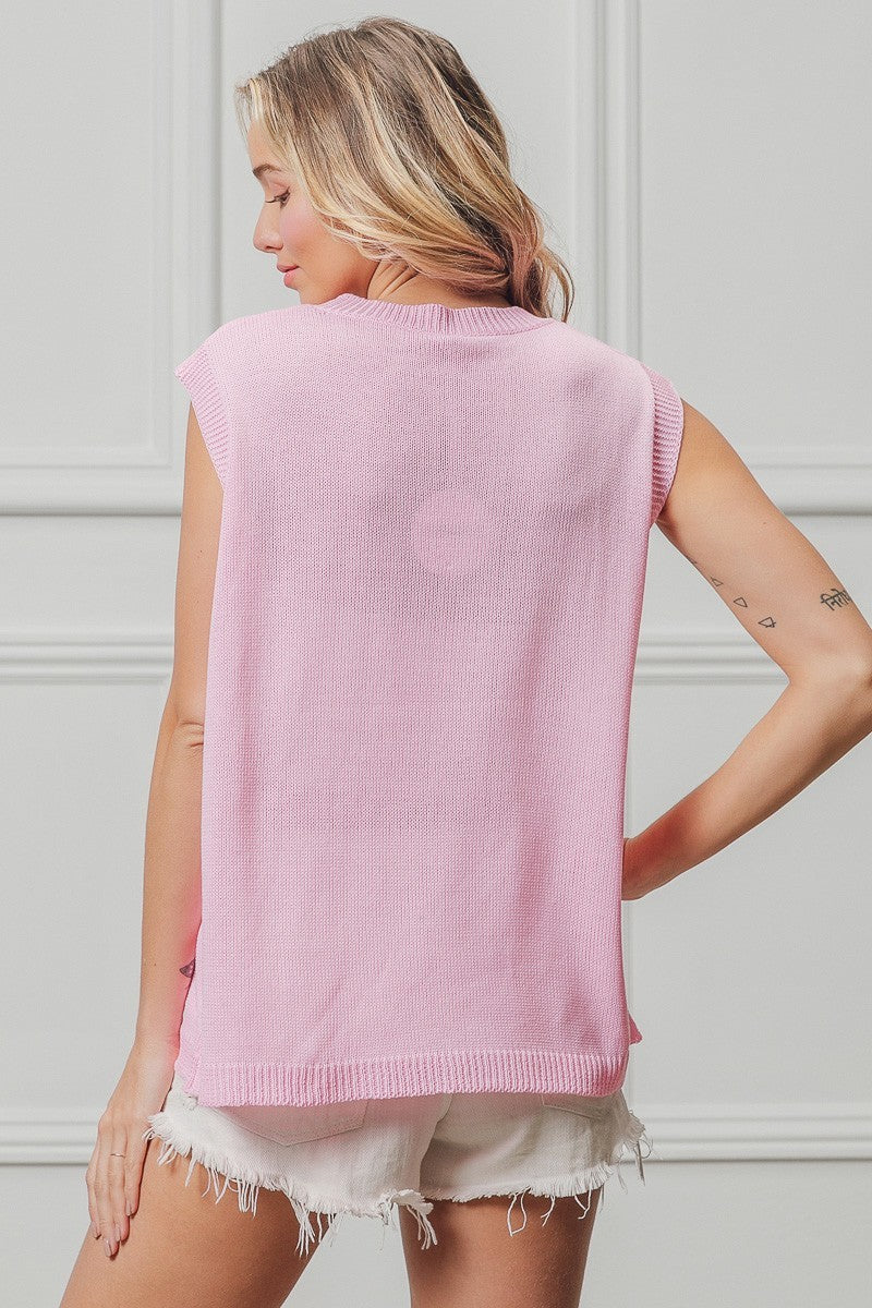 Pink sleeveless knit top back view with ribbed hem