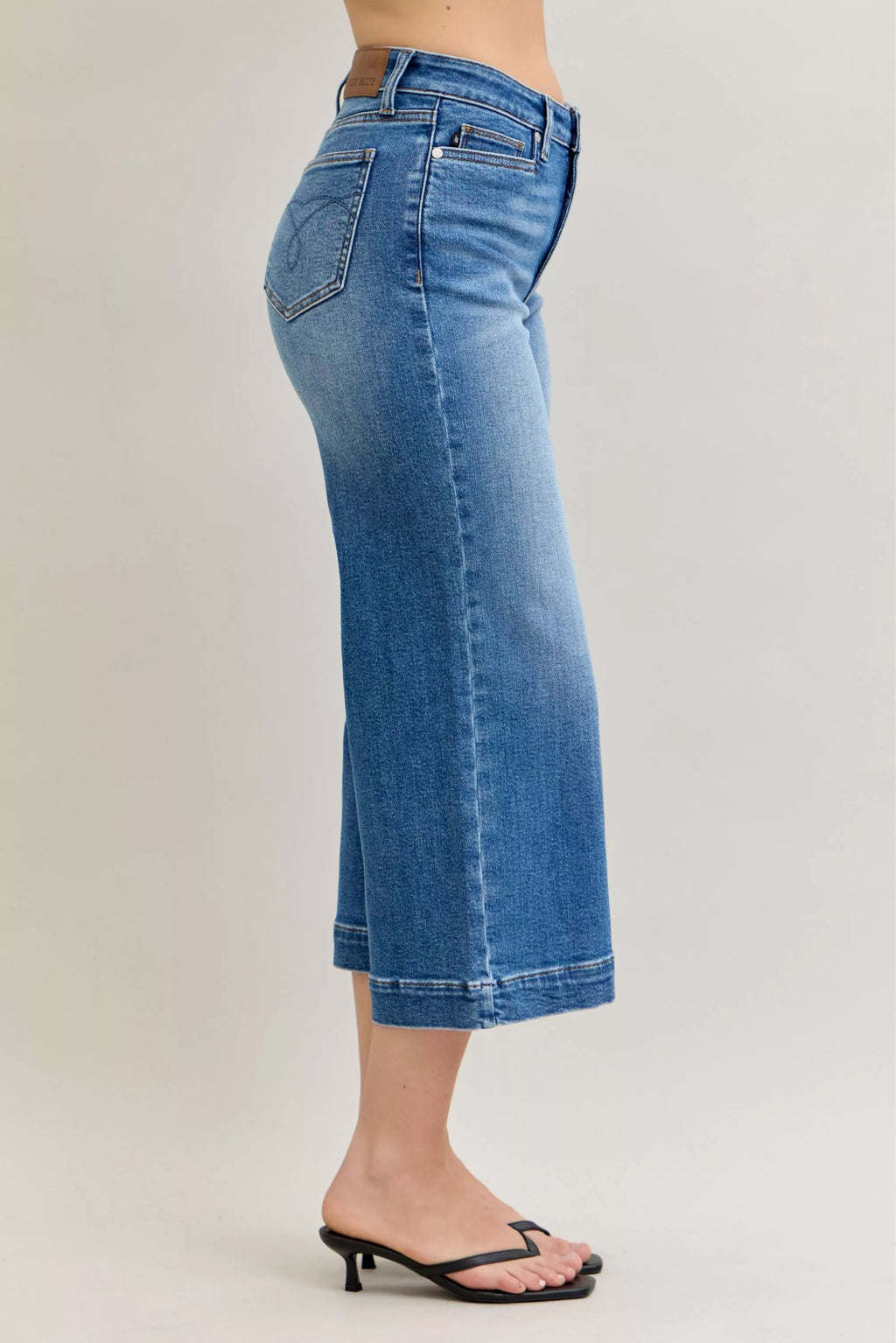 Judy Blue mid rise crop wide-leg jeans, light blue denim, visible back yoke