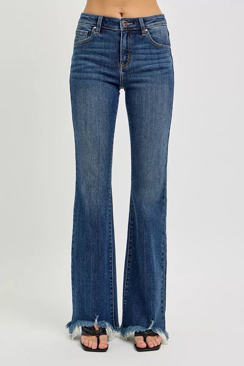 Dark blue mid-rise flare jeans back view with frayed hem