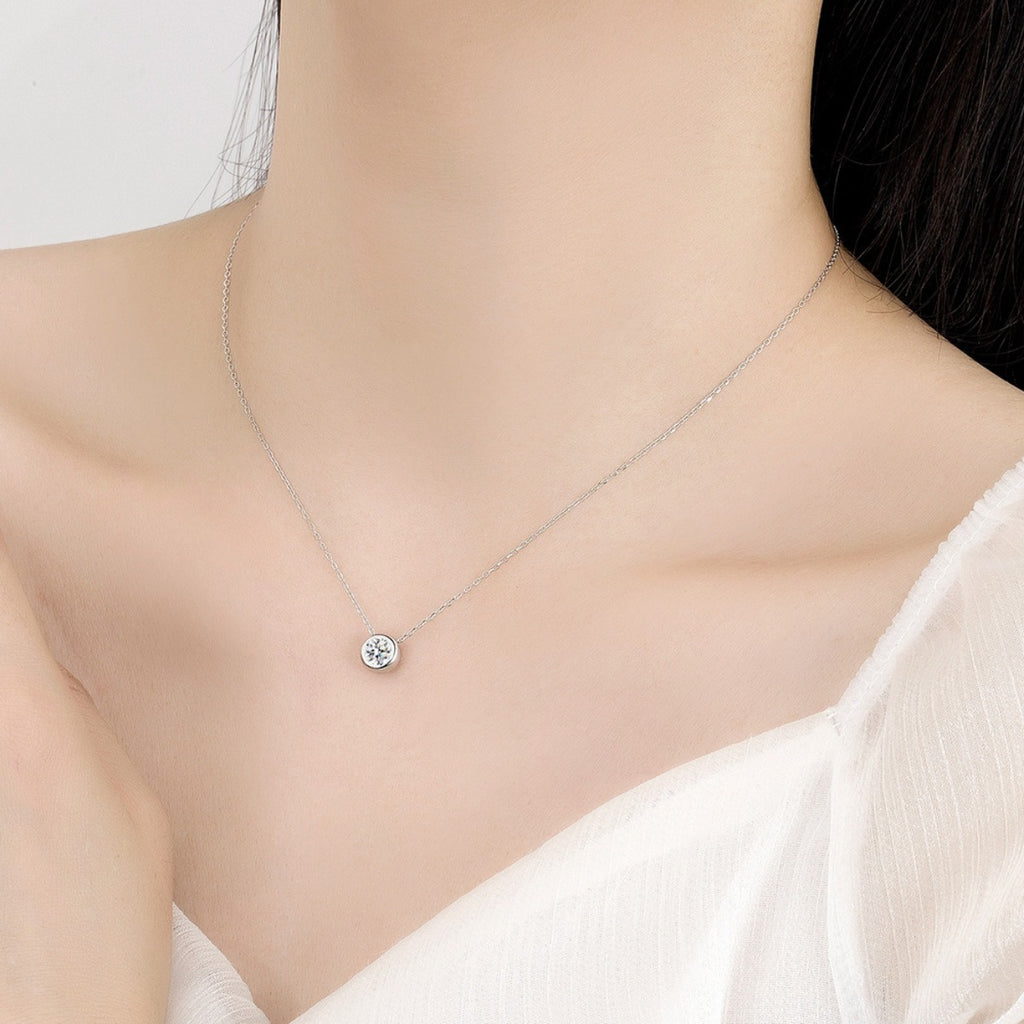 Moissanite solitaire pendant necklace on silver chain, centered round stone