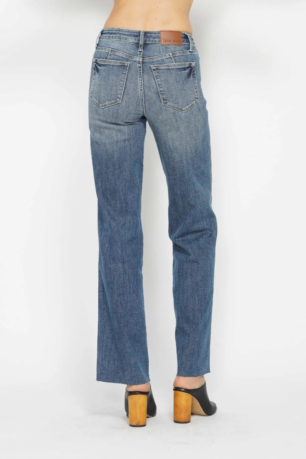 Medium wash straight jeans with back pockets and belt loops